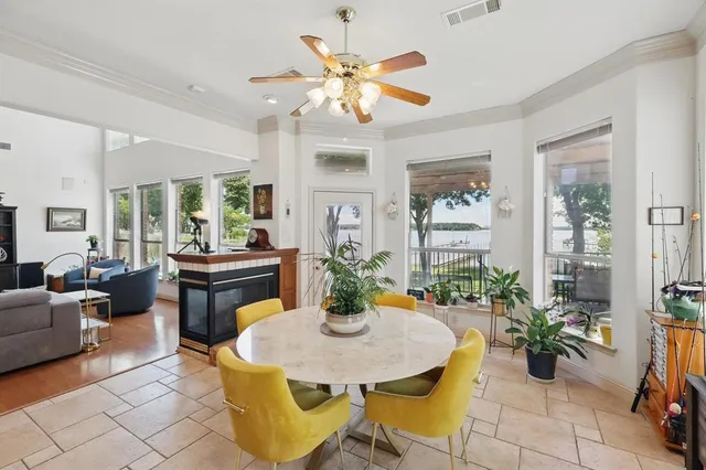 a view of a dining room with furniture and a chandelier