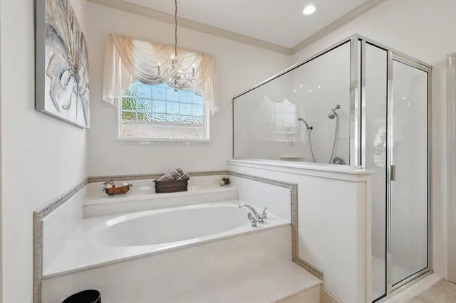 a bathroom with a bathtub and a window