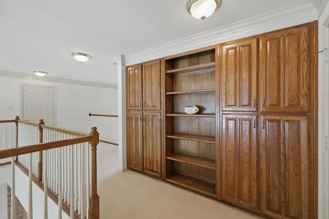 a view of kitchen with wooden floor and electronic appliances