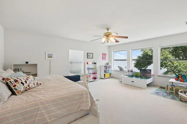 a bedroom with furniture and a chandelier