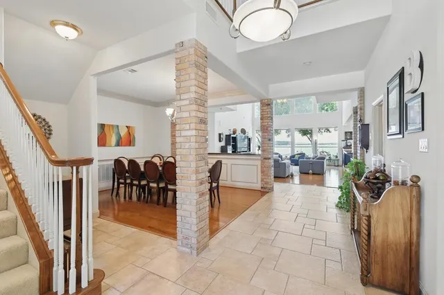 a lobby with furniture and a potted plant