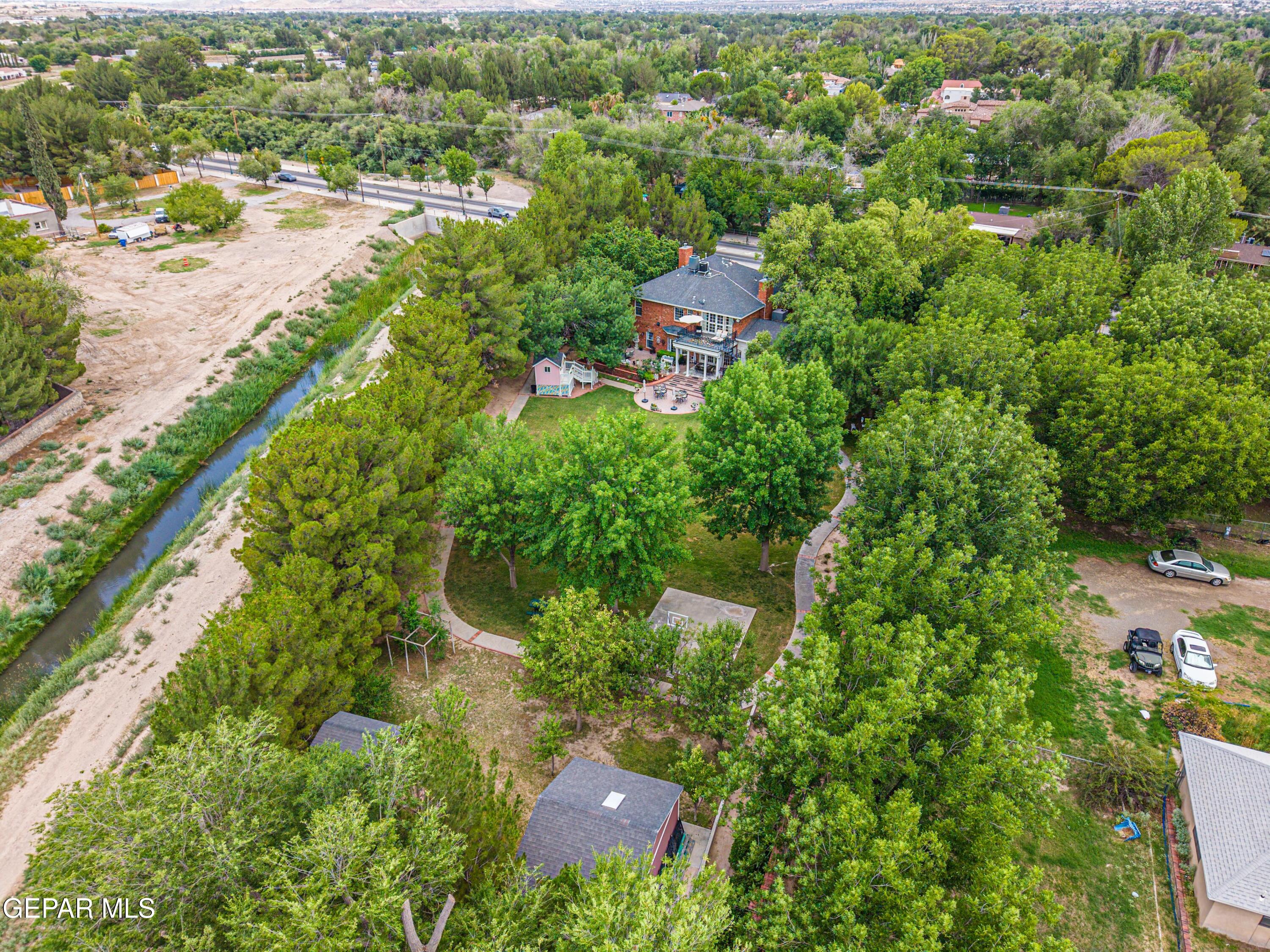 501 Country Club Road El Paso, TX 79932 - Photo 7 of 88 an aerial view of residential houses with outdoor space and trees all around