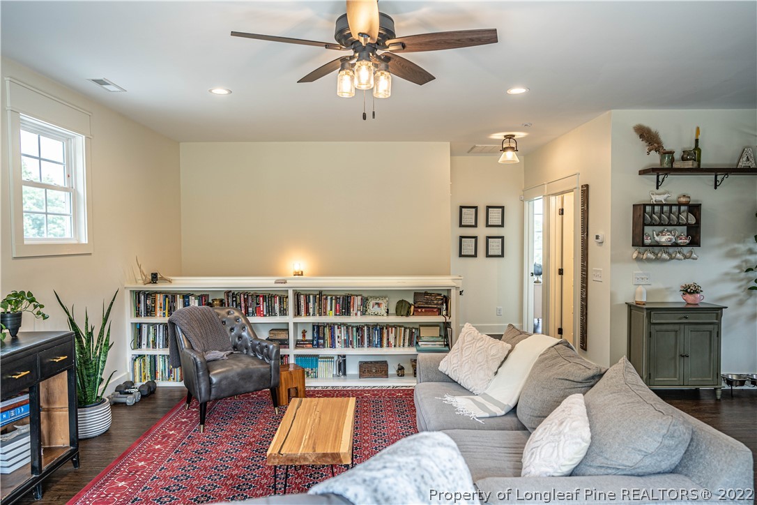 491 Stage Road Carthage, NC 28327 - Photo 16 of 47 a living room with furniture or couch and a bookshelf