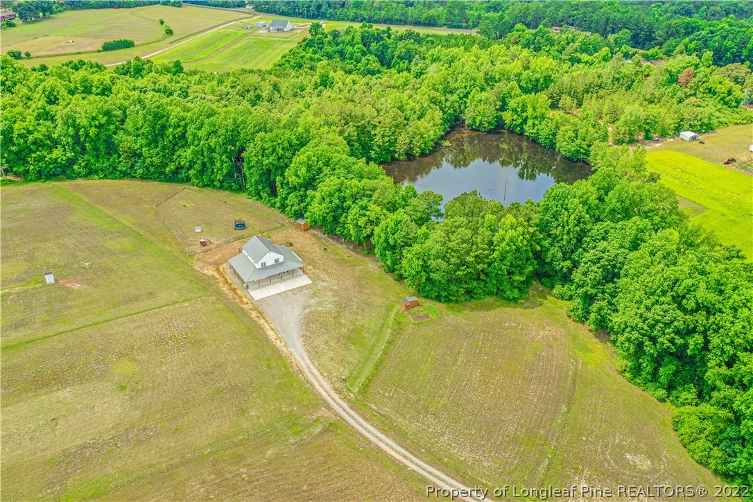 491 Stage Road Carthage, NC 28327 - Photo 2 of 47 a view of a swimming pool with a yard