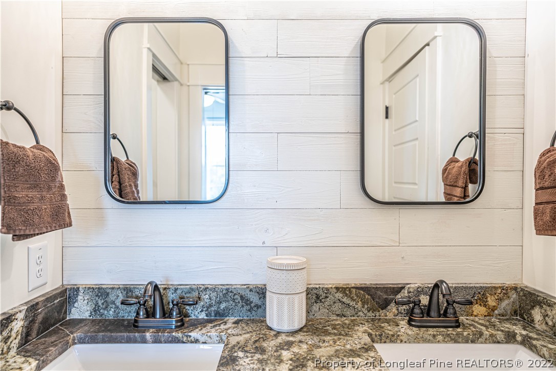 491 Stage Road Carthage, NC 28327 - Photo 22 of 47 a bathroom with a sink and mirror