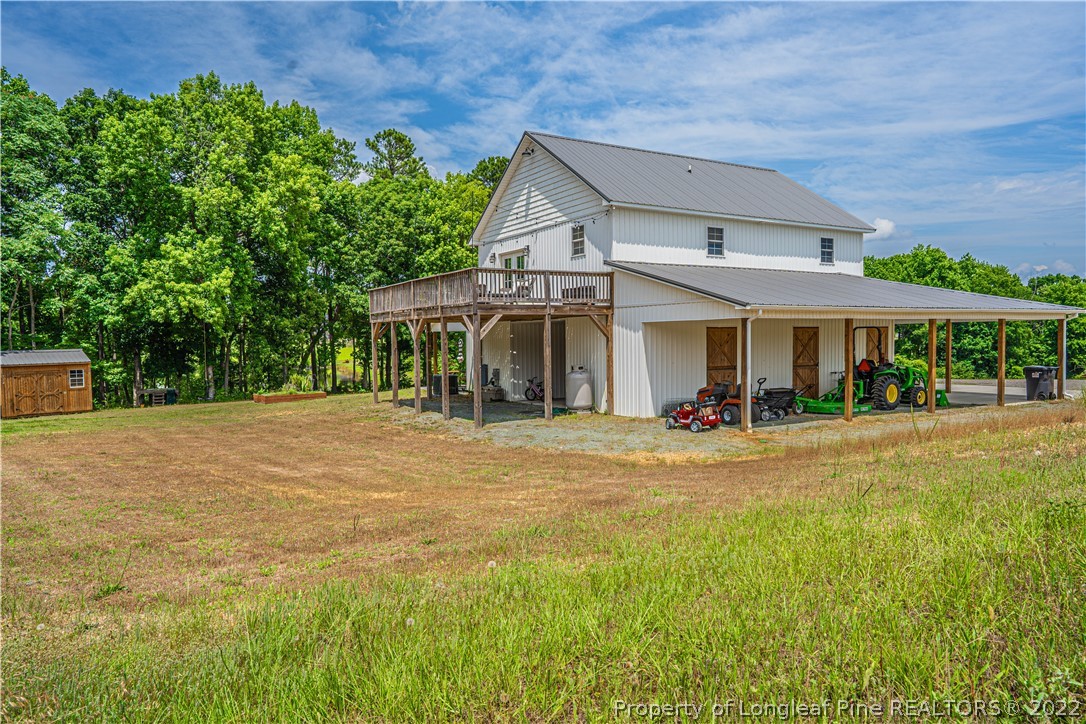 491 Stage Road Carthage, NC 28327 - Photo 40 of 47 a view of a house with a yard and large tree