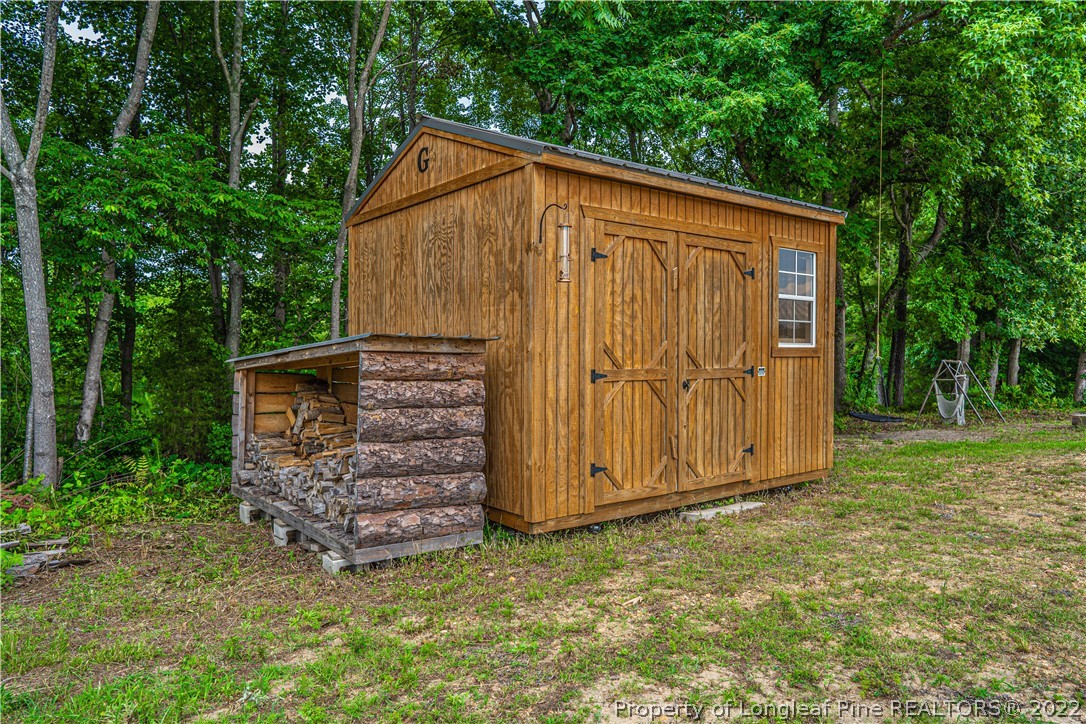 491 Stage Road Carthage, NC 28327 - Photo 46 of 47 a view of a small house with backyard