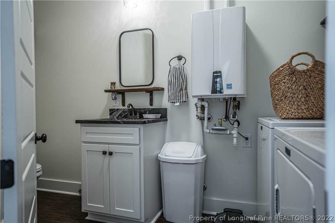 491 Stage Road Carthage, NC 28327 - Photo 7 of 47 a bathroom with a toilet sink and mirror