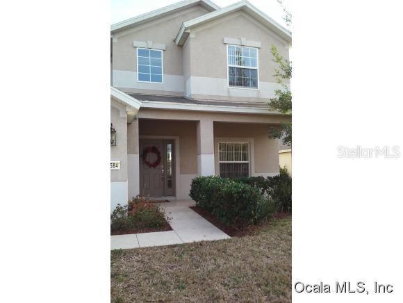 5584 Southwest 39th Street Ocala, FL 34474 - Photo 1 of 1 a view of a house with a small yard and plants