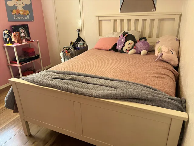 a bed room with a bed and a window