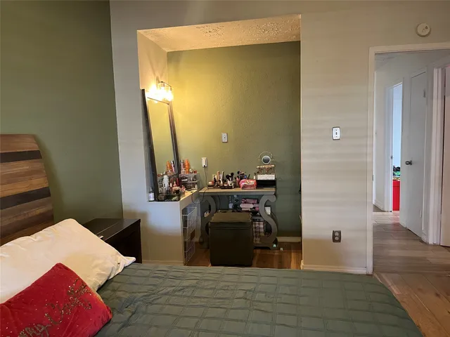 a view of a balcony with wooden floor