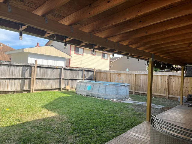 a view of a backyard with sitting area