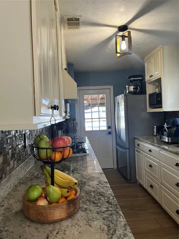 a room with two chandeliers