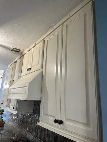 a view of staircase with white walls