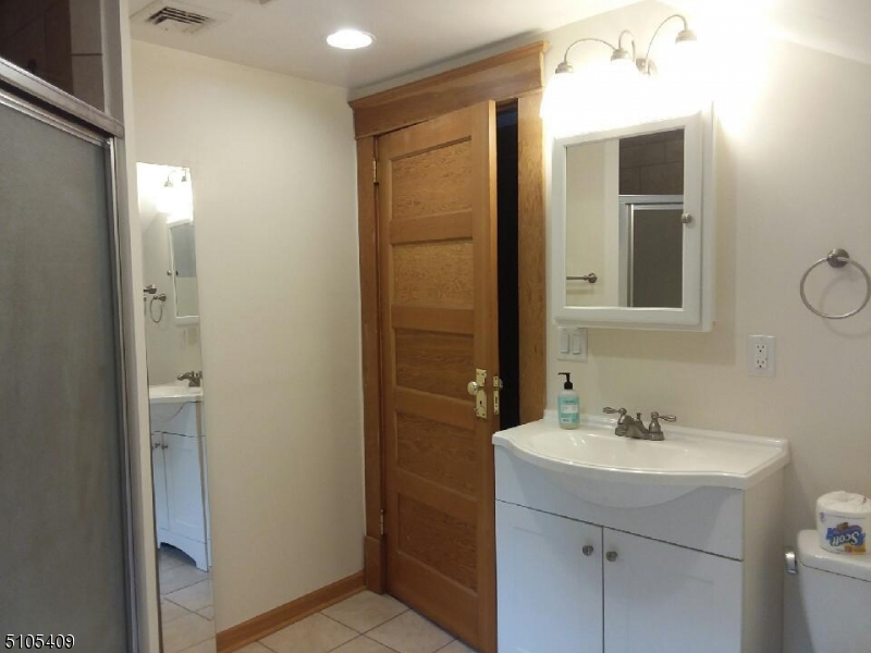 1 Myrtle Avenue Madison, NJ 07940 - Photo 15 of 21 a bathroom with a sink and a mirror