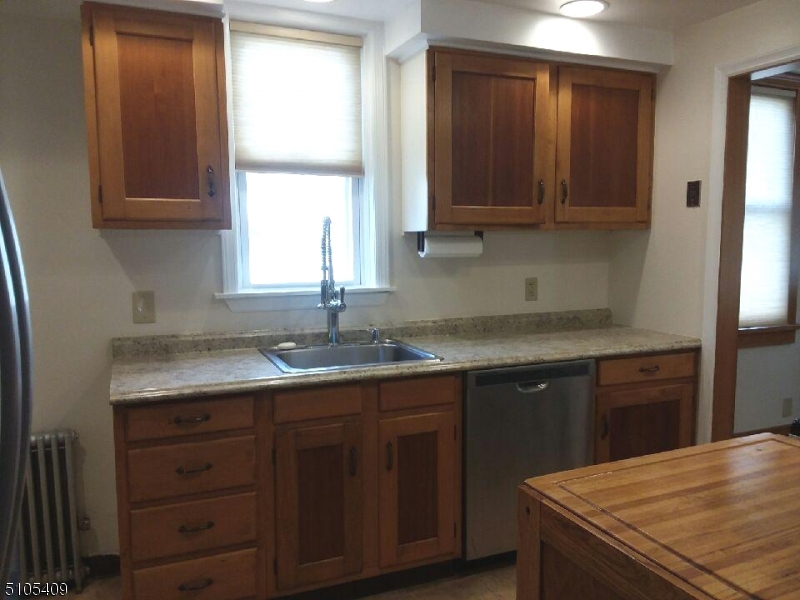1 Myrtle Avenue Madison, NJ 07940 - Photo 20 of 21 a kitchen with a sink a window and cabinets