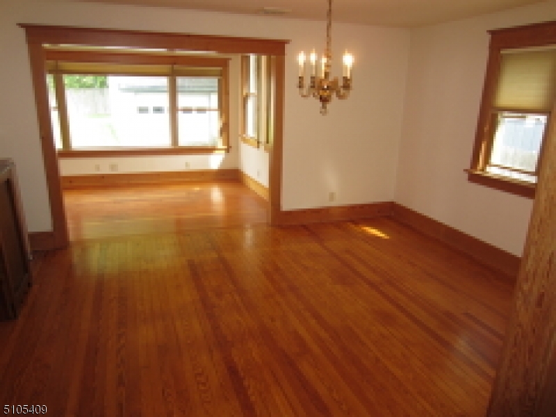 1 Myrtle Avenue Madison, NJ 07940 - Photo 3 of 21 a view of an empty room with wooden floor and a window