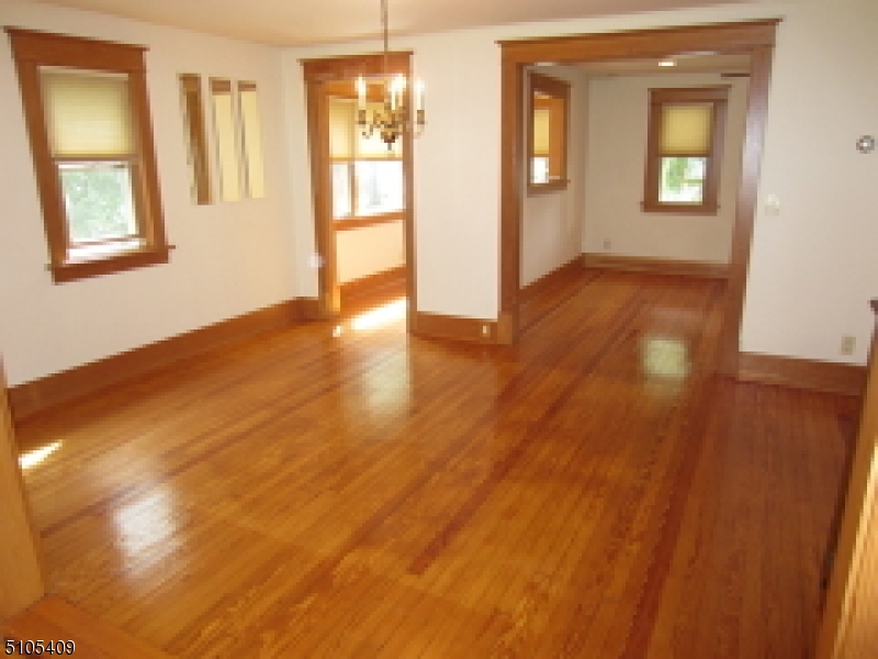 1 Myrtle Avenue Madison, NJ 07940 - Photo 4 of 21 a view of livingroom with hardwood floor and hallway