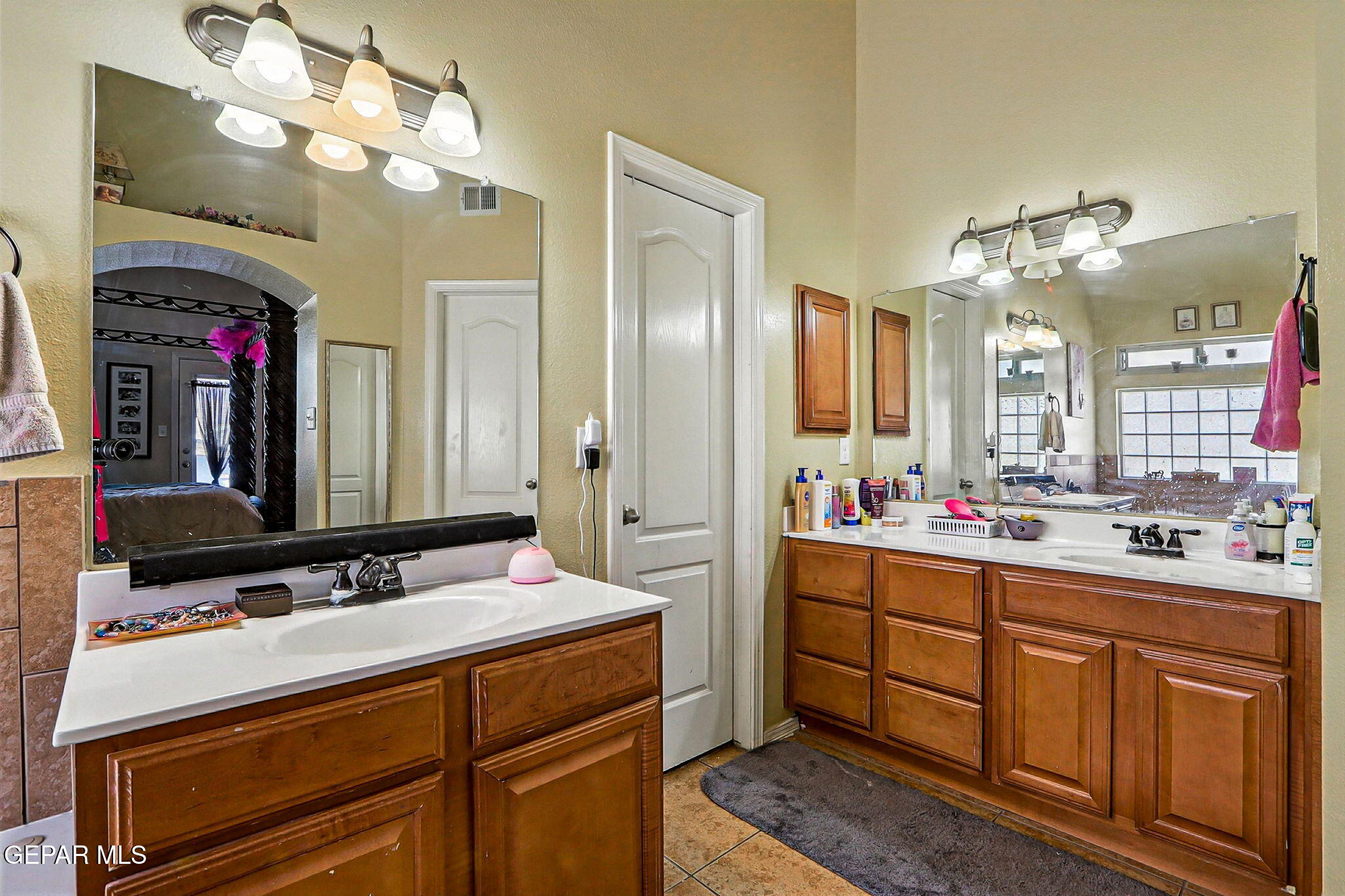 6505 Berringer Street El Paso, TX 79932 - Photo 25 of 51 a bathroom with a sink vanity and a mirror