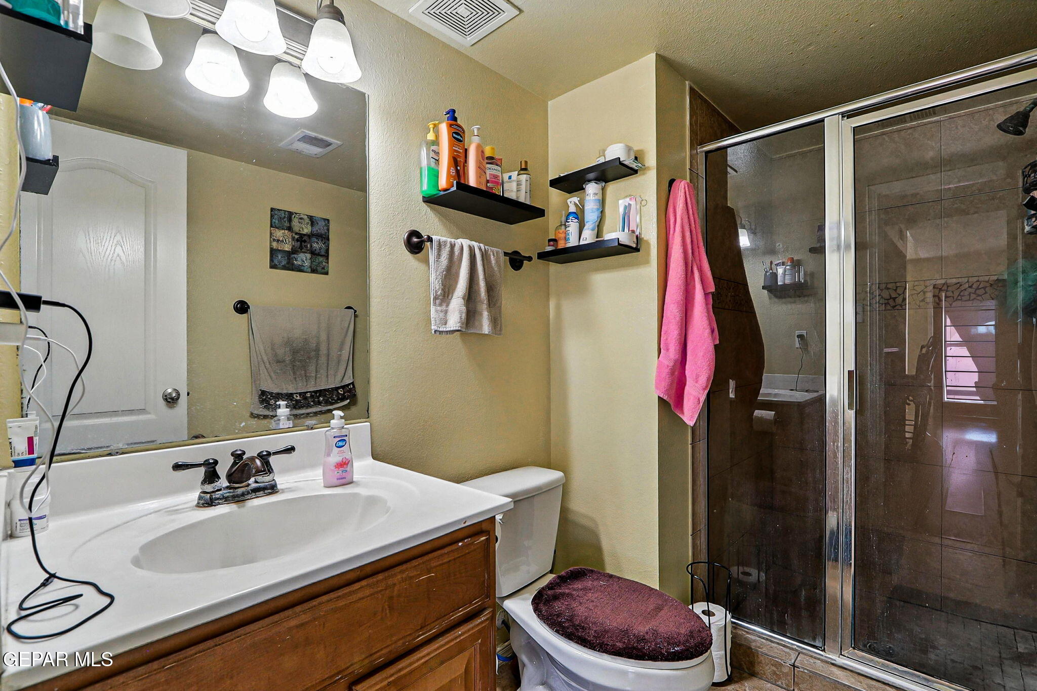 6505 Berringer Street El Paso, TX 79932 - Photo 27 of 51 a bathroom with a sink a toilet and shower
