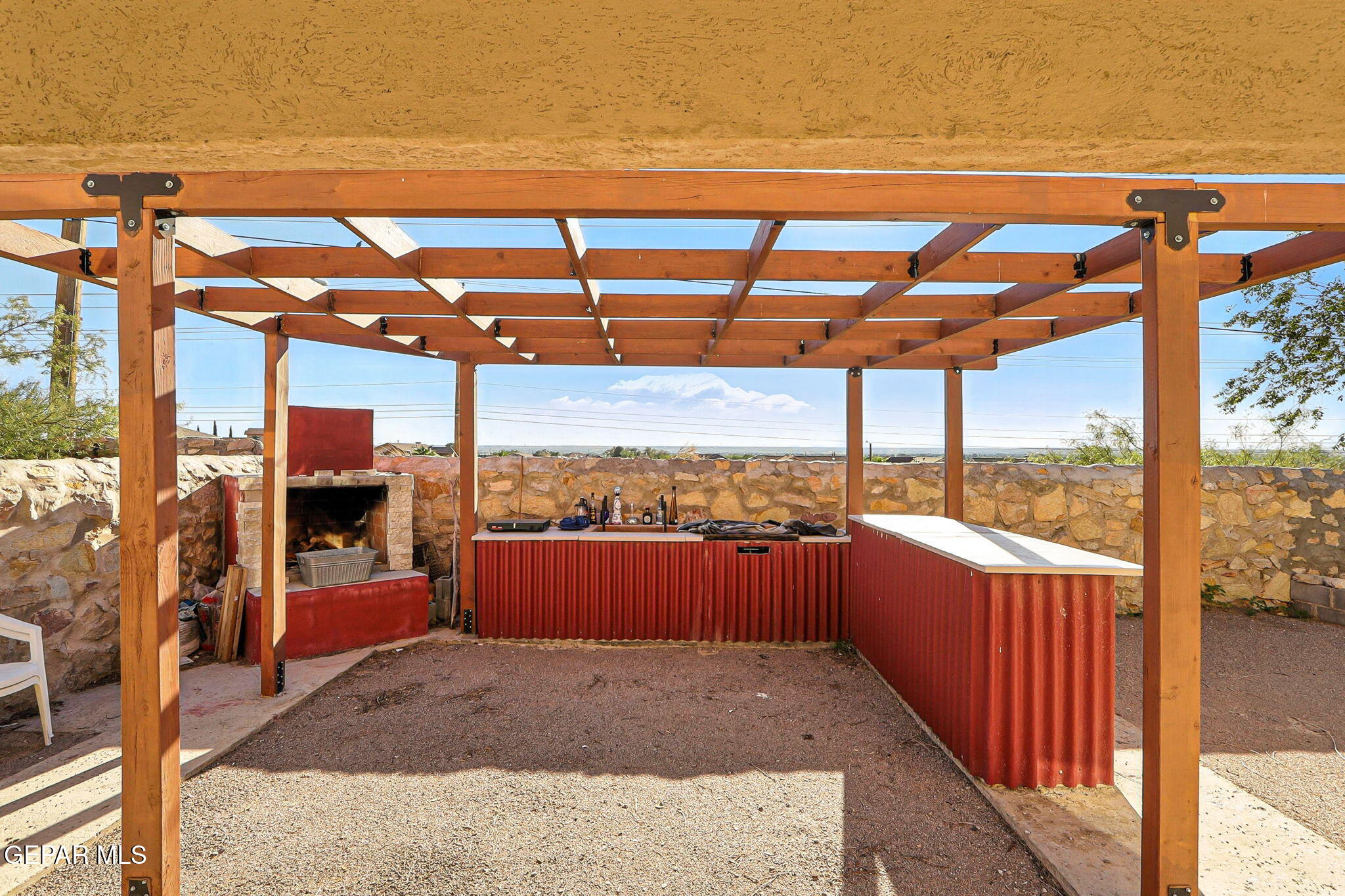 6505 Berringer Street El Paso, TX 79932 - Photo 32 of 51 a view of a patio with a table and chairs