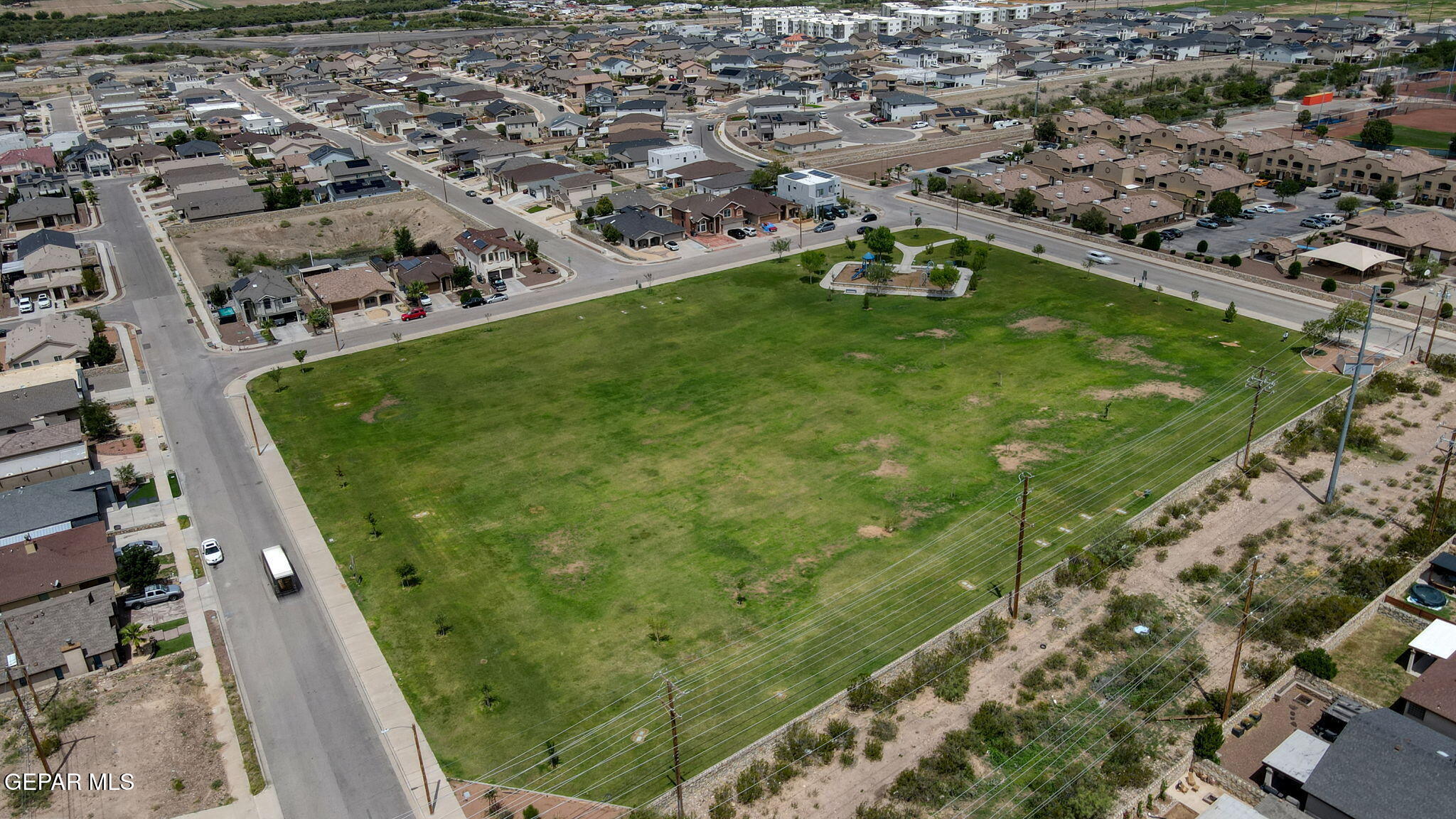 6505 Berringer Street El Paso, TX 79932 - Photo 48 of 51 an aerial view of a golf course with parking space