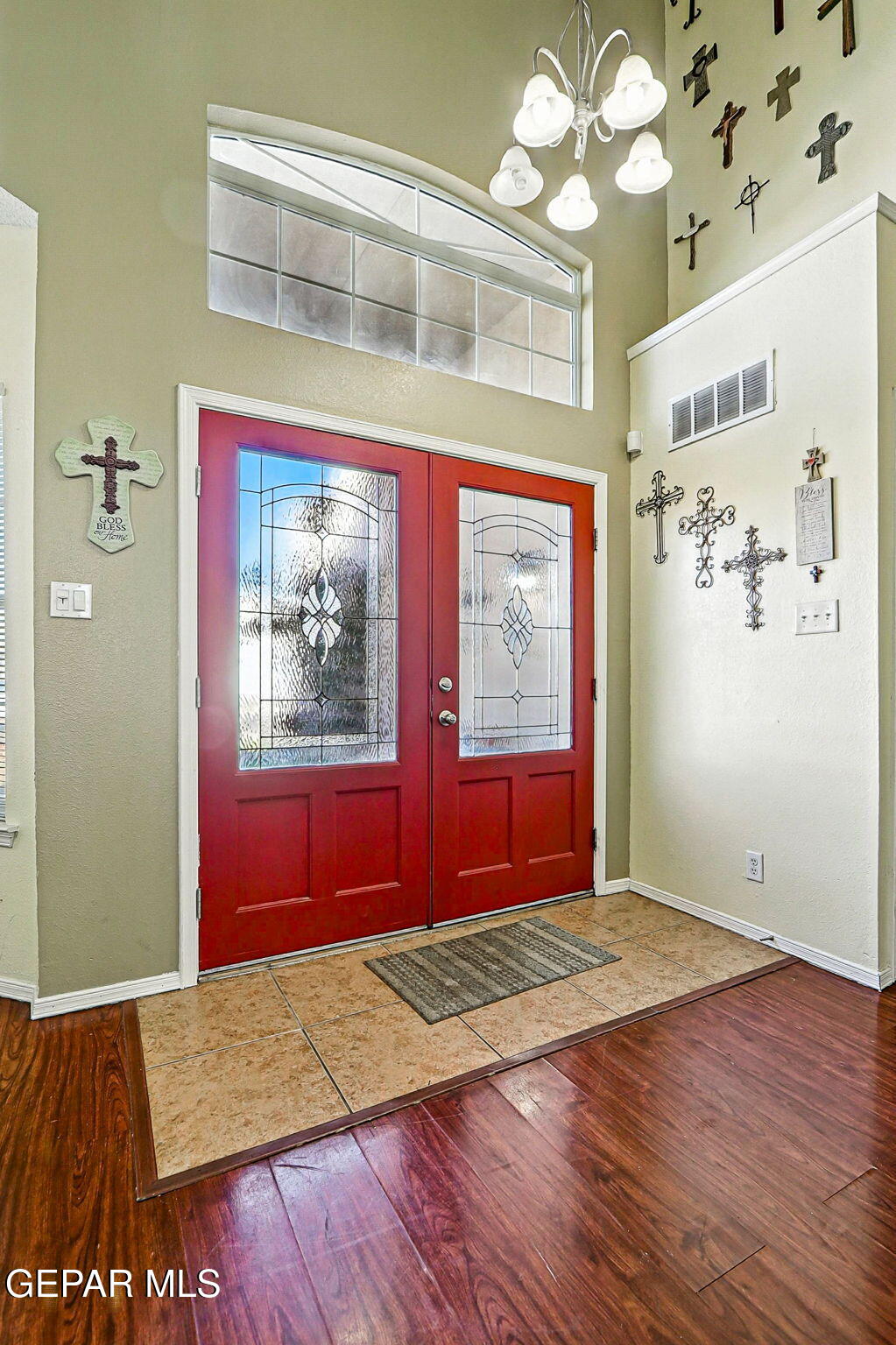 6505 Berringer Street El Paso, TX 79932 - Photo 6 of 51 an empty room with wooden floor and windows