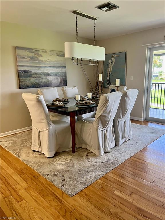 348 Tern Drive, Unit 4 Naples, FL 34112 - Photo 4 of 27 a living room with a table