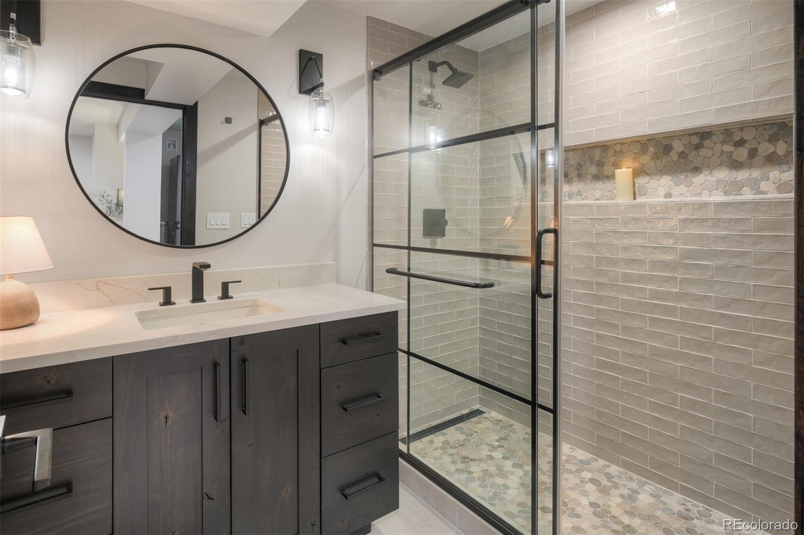 306 Golden Eagle Road Silverthorne, CO 80498 - Photo 34 of 43 a bathroom with a sink and a mirror