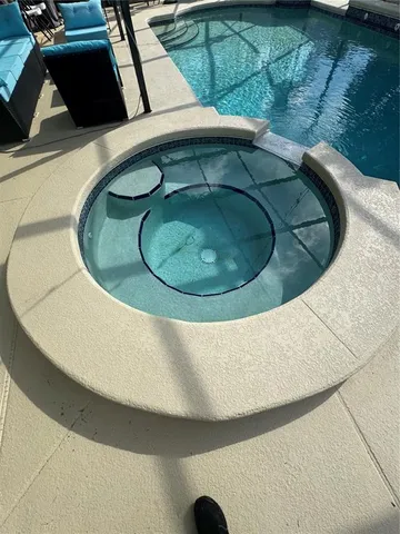 a building outdoor space with patio furniture and potted plants