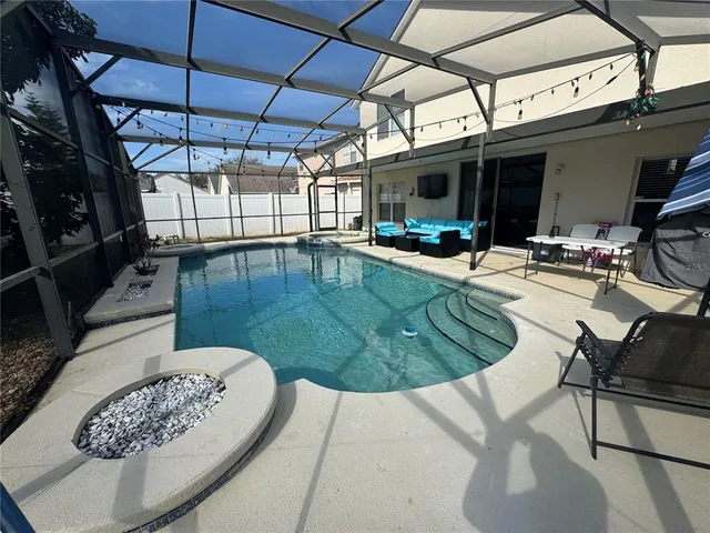 a bathroom with a granite countertop sink a mirror and vanity