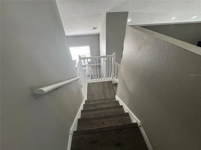 a bathroom with a sink a toilet a shower and a mirror