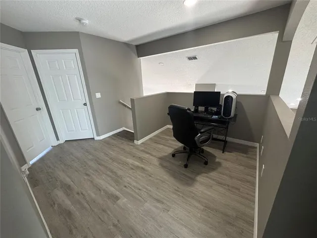 a bathroom with a tub and a window