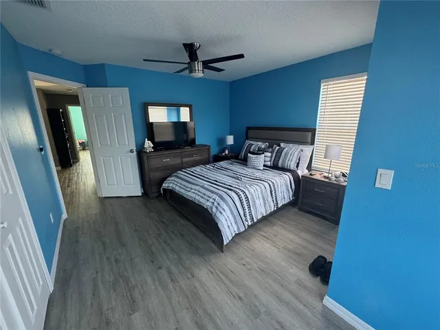 a bedroom with a bed and a dresser