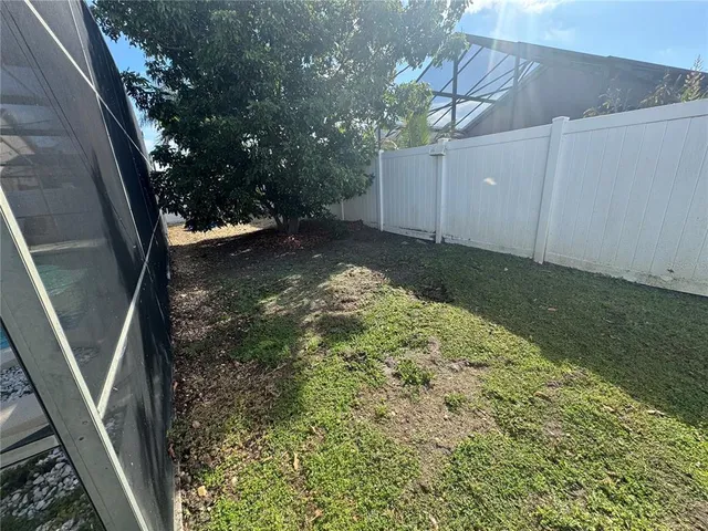 a backyard of a house with lots of green space