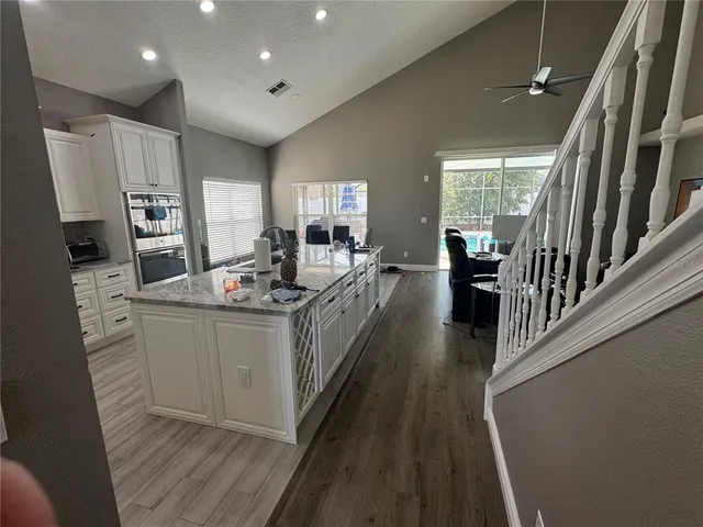a kitchen with stainless steel appliances granite countertop lots of counter top space