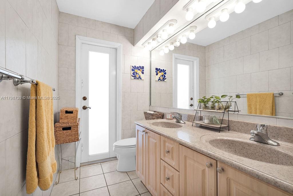 6551 Southwest 126th Street Pinecrest, FL 33156 - Photo 22 of 39 a bathroom with a sink a toilet and shower
