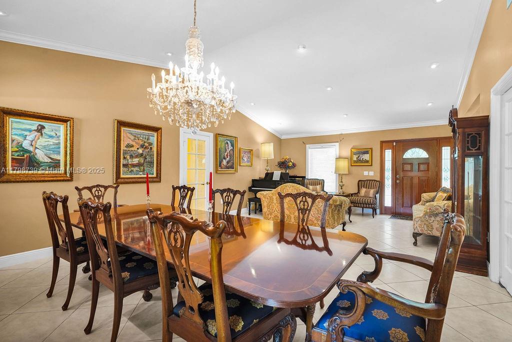 6551 Southwest 126th Street Pinecrest, FL 33156 - Photo 28 of 39 a view of a dining room with furniture window and outside view