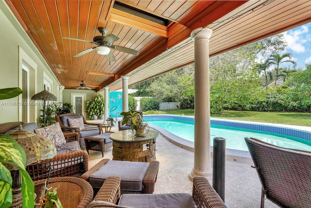 6551 Southwest 126th Street Pinecrest, FL 33156 - Photo 33 of 39 a outdoor space with patio the couches and chairs