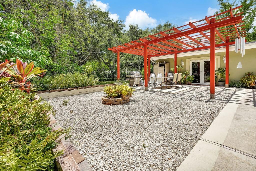 6551 Southwest 126th Street Pinecrest, FL 33156 - Photo 34 of 39 a view of a chairs and tables in the patio