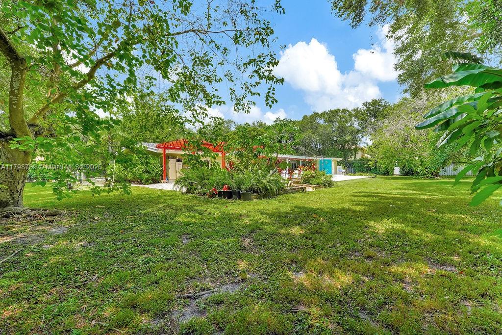 6551 Southwest 126th Street Pinecrest, FL 33156 - Photo 35 of 39 a view of a house with a backyard