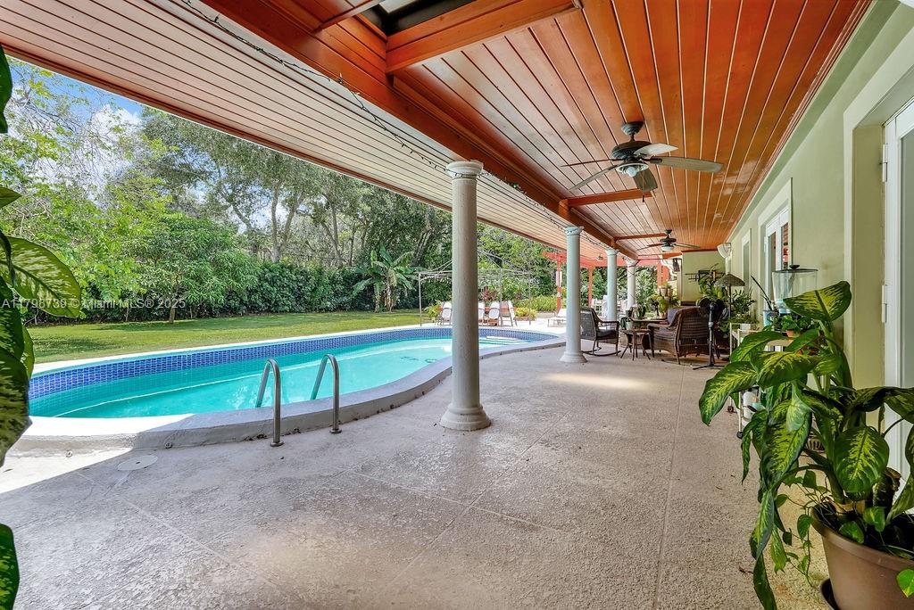 6551 Southwest 126th Street Pinecrest, FL 33156 - Photo 37 of 39 a view of backyard with porch