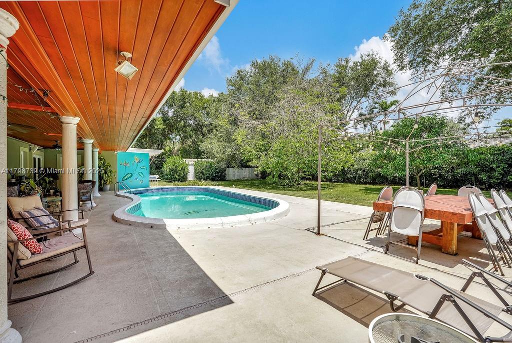 6551 Southwest 126th Street Pinecrest, FL 33156 - Photo 4 of 39 a view of a backyard with sitting area