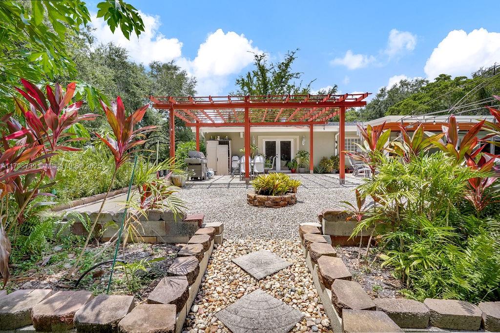 6551 Southwest 126th Street Pinecrest, FL 33156 - Photo 5 of 39 a view of a backyard with sitting area