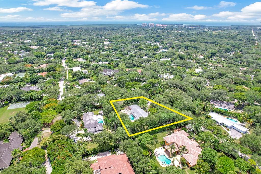 6551 Southwest 126th Street Pinecrest, FL 33156 - Photo 6 of 39 an aerial view of residential houses with outdoor space and trees