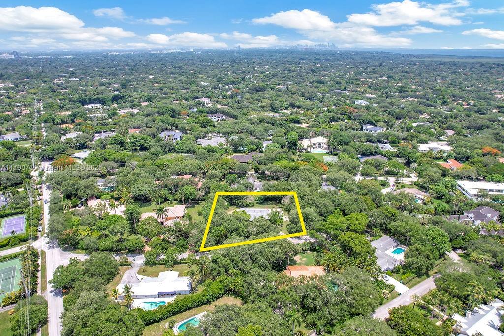 6551 Southwest 126th Street Pinecrest, FL 33156 - Photo 7 of 39 an aerial view of residential houses with outdoor space and trees