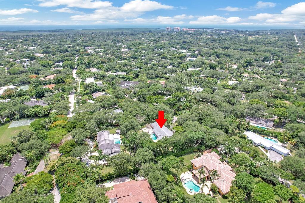 6551 Southwest 126th Street Pinecrest, FL 33156 - Photo 8 of 39 an aerial view of residential houses with city and outdoor space