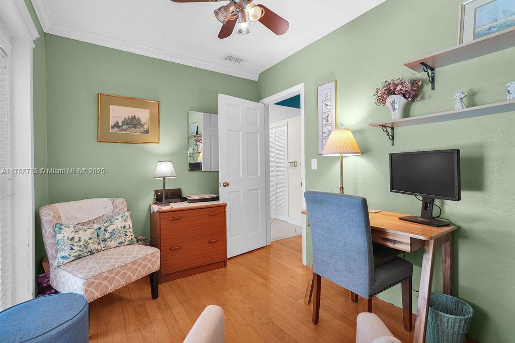 6551 Southwest 126th Street Pinecrest, FL 33156 - Photo 9 of 39 a workspace with furniture and a flat screen tv