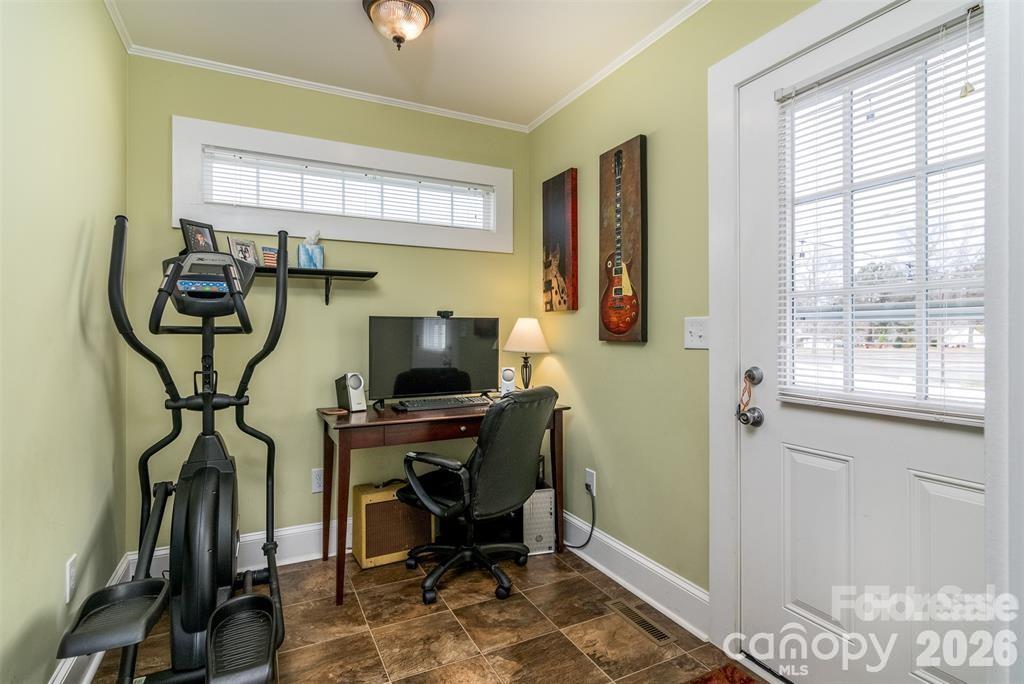 1004 Valley Street Kannapolis, NC 28081 - Photo 11 of 18 a view of a workspace with furniture and a window