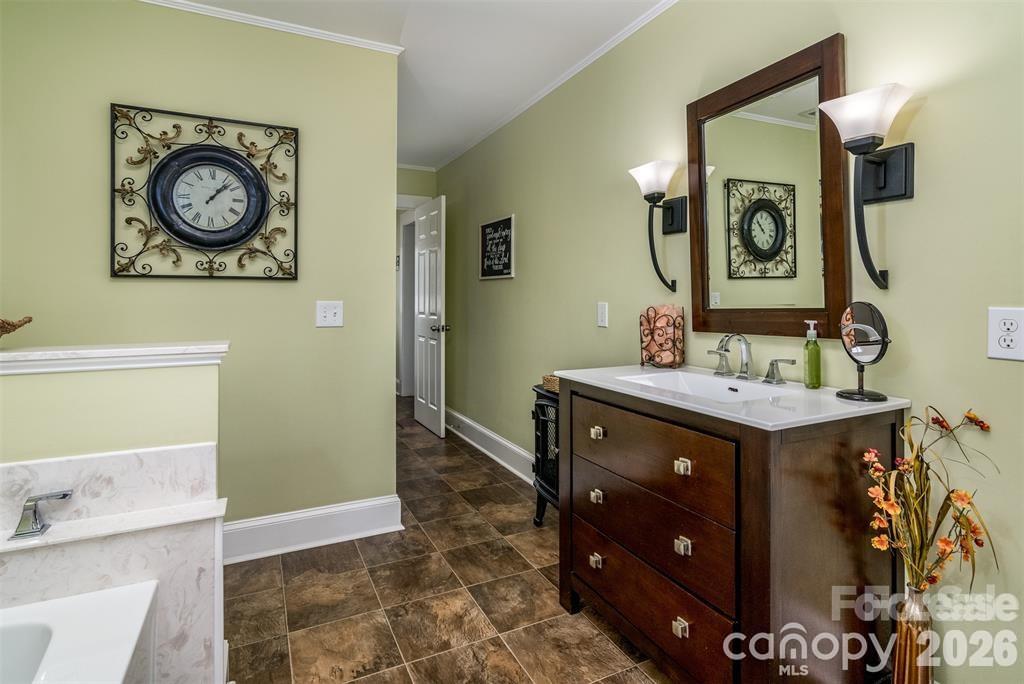 1004 Valley Street Kannapolis, NC 28081 - Photo 12 of 18 a bathroom with a sink mirror and vanity